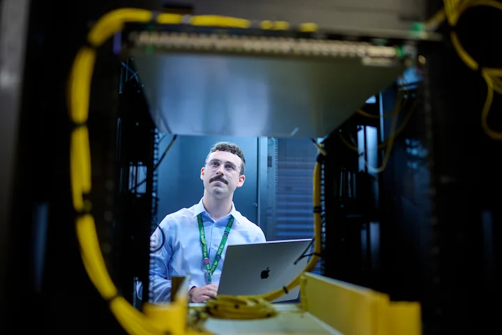 Person looking at a server rack