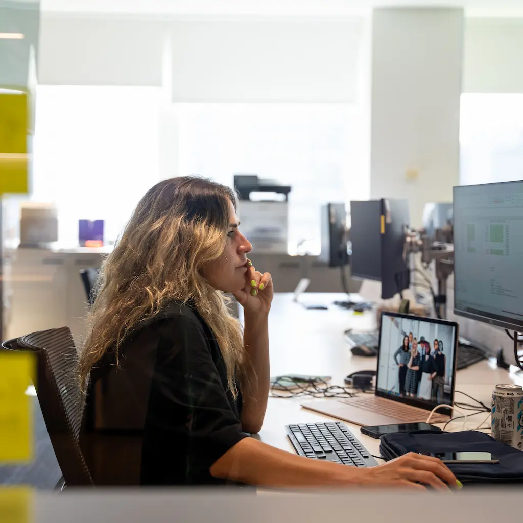 Person looking at a spreadsheet on a monitor